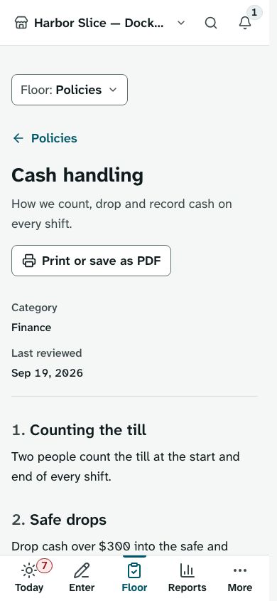 A cash handling policy on a phone, with its category, review date and numbered sections, and a Print or save as PDF button.